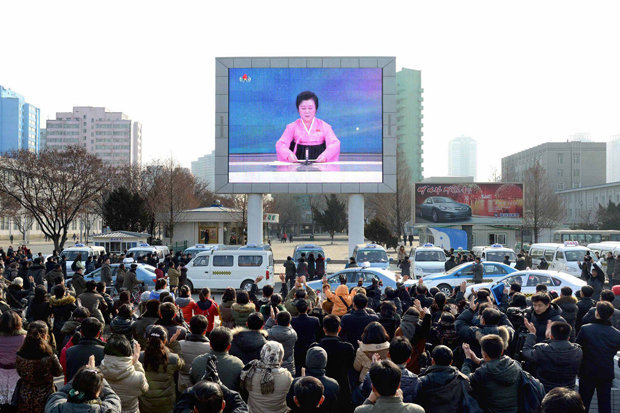 AFP  GETTY    
     CHEERS The crowd gathered to watch the announcement