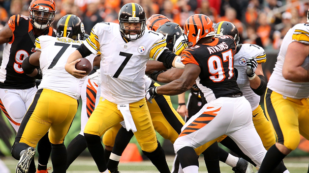 CINCINNATI OH- DECEMBER 13 Geno Atkins #97 of the Cincinnati Bengals attempts to tackle Ben Roethlisberger #7 of the Pittsburgh Steelers during the third quarter at Paul Brown Stadium