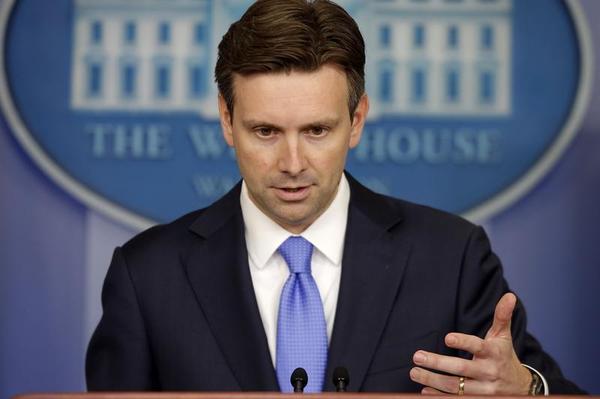 White House press secretary Josh Earnest gestures during the daily press briefing at the White House in Washington Monday Aug. 25 2014 where he took questions on ISIS Iraq and Syria. He also received congratulations for his newborn baby. (AP