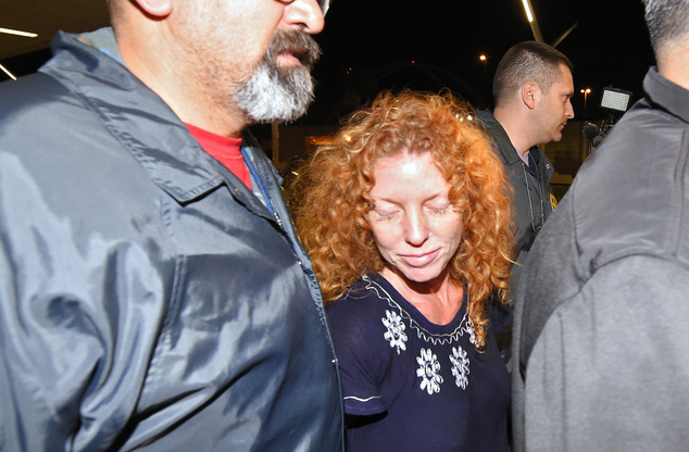 Tonya Couch center is taken by authorities to a waiting car after arriving at Los Angeles International Airport Thursday Dec. 31 2015 in Los Angeles. A