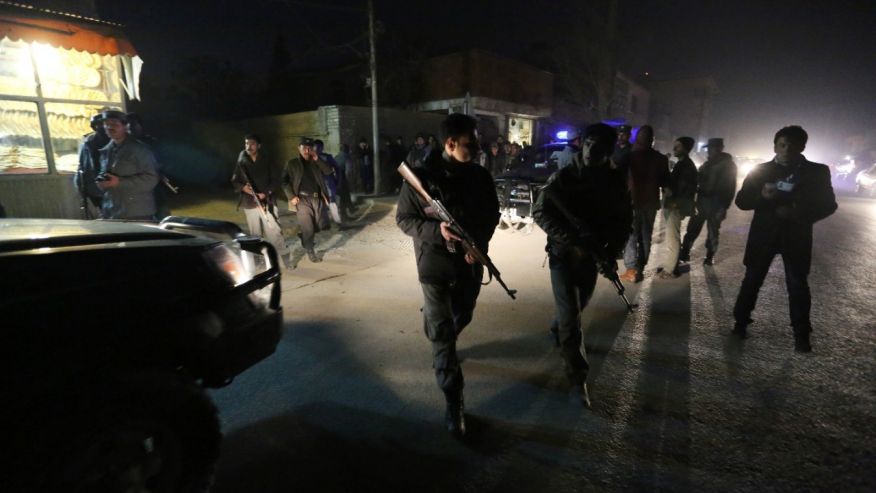 Afghan security forces inspect the site of an explosion in Kabul