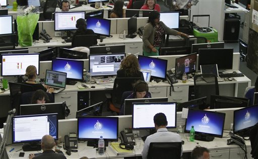 Al Jazeera America editorial newsroom staff prepare for their first broadcast in New York. The Al Jazeera America news network ousted its chief executive on Wednesday