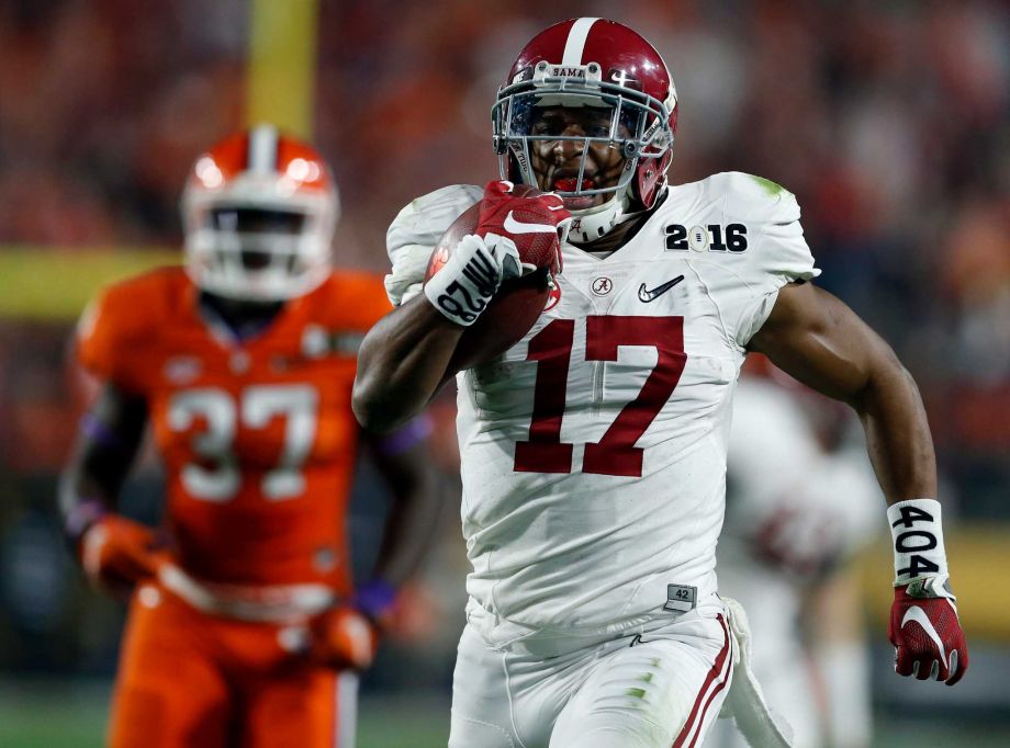 Alabama running back Kenyan Drake returns a kick off for a touchdown during the second half of the NCAA college football playoff championship game against Clemson Monday Jan. 11 2016 in Glendale Ariz. Alabama won 45-40