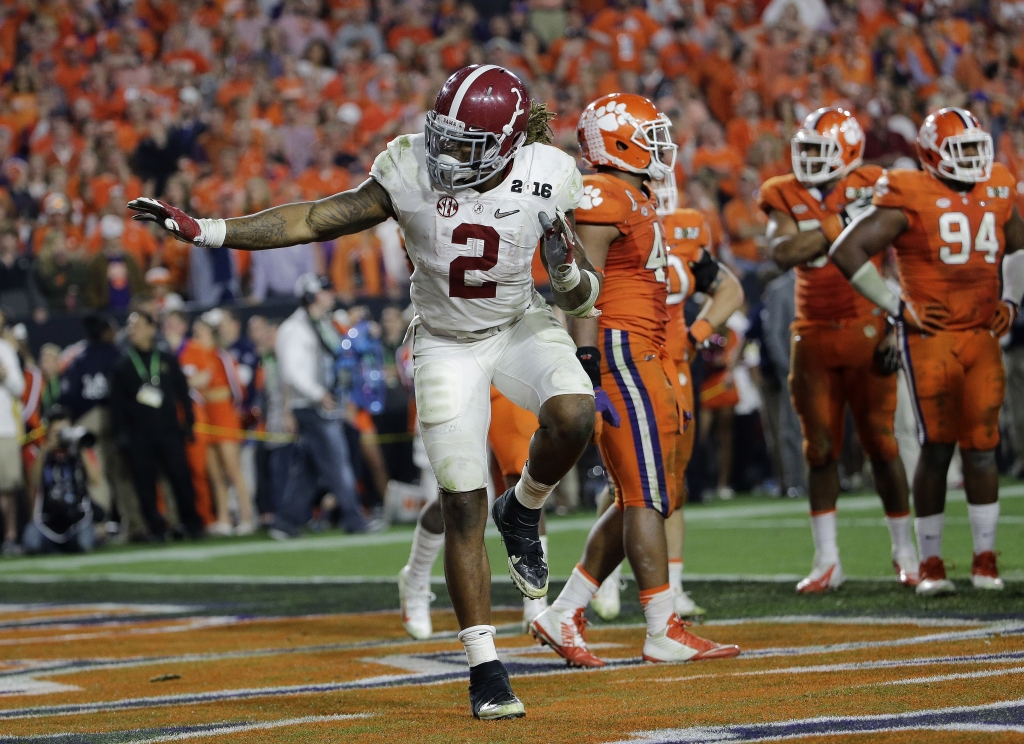 Alabama's Derrick Henry gives a Heisman pose after rushing for a touchdown during the second half of the NCAA college football playoff championship game against Clemson Monday Jan. 11 2016 in Glendale Ariz