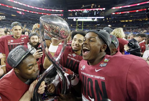 Alabama players celebrate after the Cotton Bowl NCAA college football semifinal playoff game against Michigan State Thursday Dec. 31 2015 in Arlington Texas. Alabama won 38-0 to advance to the championship game