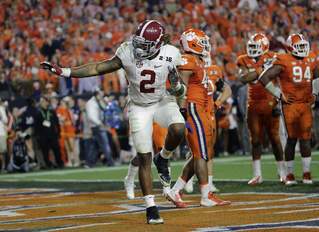 ASSOCIATED PRESS           Alabama’s Derrick Henry gives a Heisman pose after rushing for a touchdown during the second half of the NCAA college football playoff championship game against Clemson tonight in Glendale Ariz