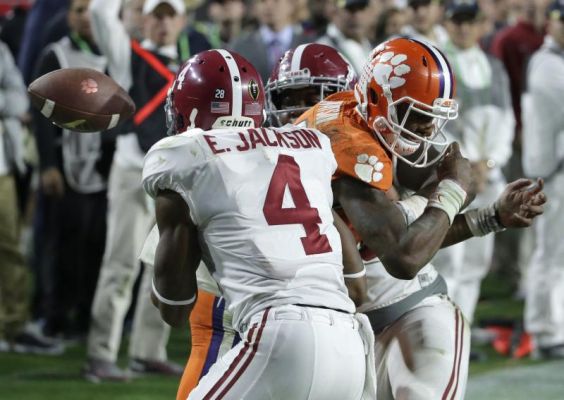 Clemson's Deshaun Watson loses the ball as