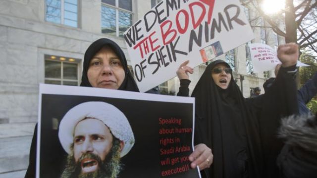 Amel Al-Hajjar left and Khadija Fali participate in a rally in front of the Saudi Arabian embassy in Washington on Jan. 5 2016