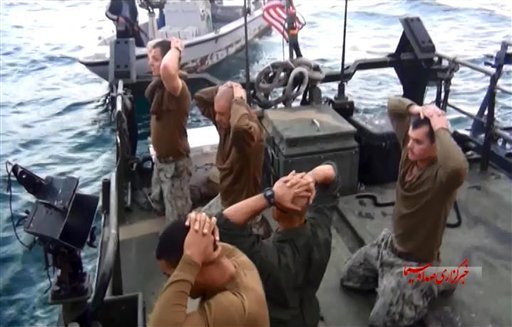 This frame grab from Tuesday video by the Iranian state-run IRIB News Agency shows detention of American Navy sailors by the Iranian Revolutionary Guards in the Persian Gulf Iran