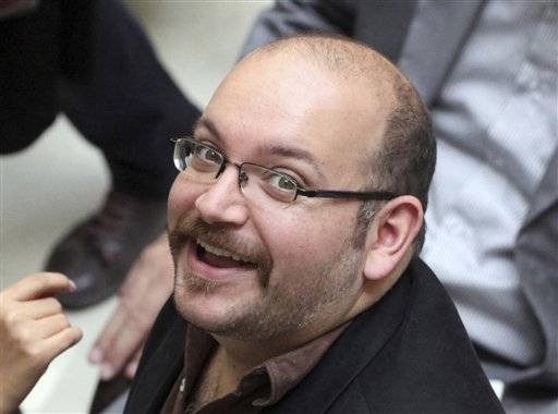 Jason Rezaian an Iranian American correspondent for the Washington Post smiles as he attends a presidential campaign of President Hassan Rouhani in Tehran Iran. Iran state television has reported that the government