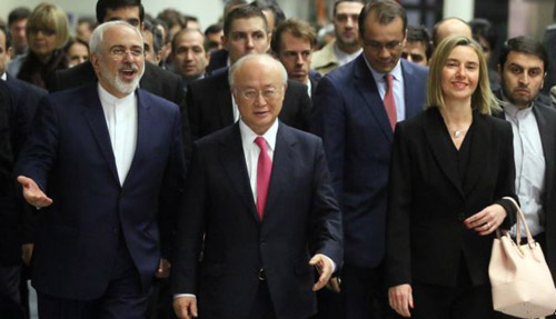 Iranian Foreign Minister Mohammad Javad Zarif, Director General of the International Atomic Energy Agency IAEA Yukiya Amano of Japan and European Union High Representative Federica Mogherini arrive at the International Atomic Energy Agenc