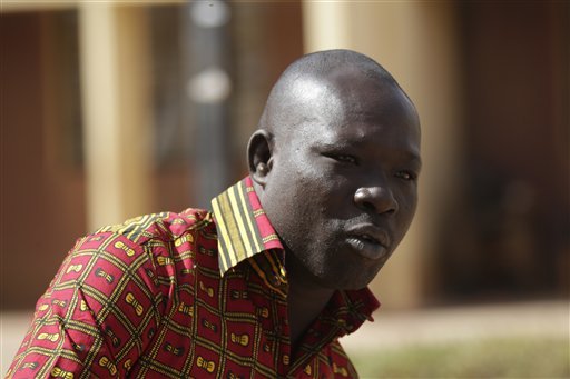 Clement Djiguende who works at the Cappuccino Cafe talks of his escape as al Qaida fighters attacked the cafe in Ouagadougou Burkina Faso Sunday Jan. 17 2016. At least 10 of the 28 victims of the Ouagadougou attacks lost their lives at the cafe tha