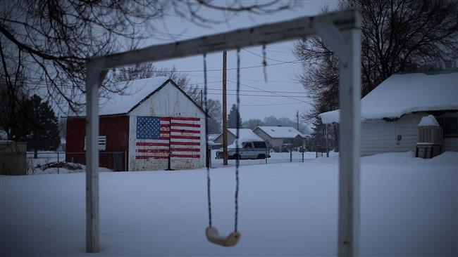 An American flag is painted on the side of an outbuilding