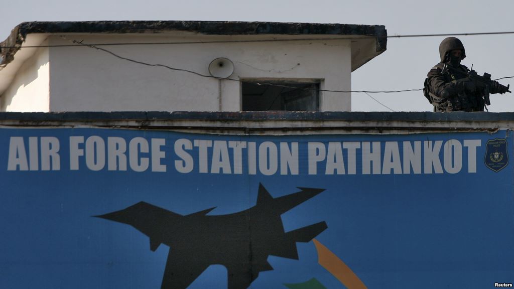 An Indian security personnel stands guard on a building at the Indian Air Force base at Pathankot in Punjab India Jan. 5 2016