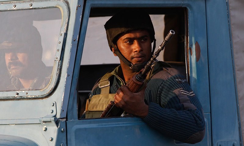 An Indian soldier looks from inside a vehicle at the Indian air force base in Pathankot India Tuesday.─AP