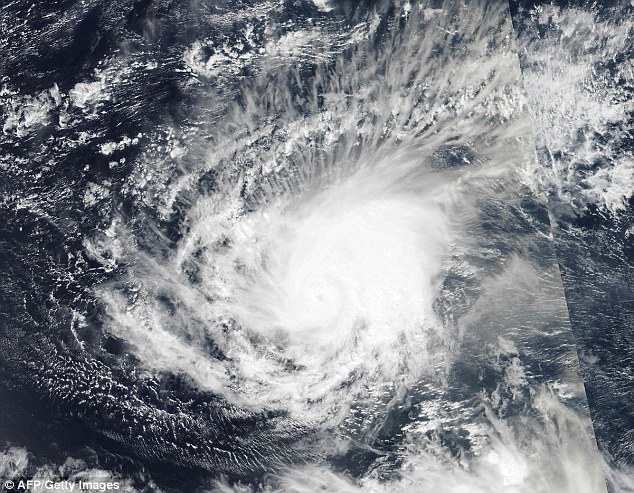 An image from a NASA satellite shows a rare hurricane forming in the Atlantic. It is the first to develop in the month of January since 1938