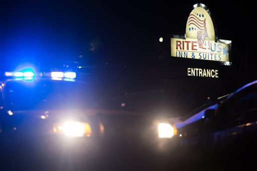 Police work the scene of a standoff at the Rite4 Us Inn and Suites on Snapfinger Woods Drive Tuesday Jan. 5 2016 in Decatur Ga. A standoff at a motel outside Atlanta that involved a number of children ended Tuesday morning with the suspect stabbing