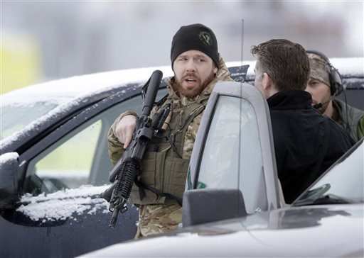 Members of the FBI stand guard at the Burns Municipal Airport Sunday Jan. 10 2016 in Burns Ore. A small armed group has been occupying a remote national wildlife refuge in Oregon since a week earlier to protest federal land use policies. (AP