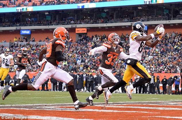 Antonio Brown makes a touchdown watch during Pittsburgh's win against the Cleveland Browns on Sunday