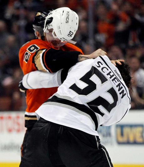 Los Angeles Kings defenseman Luke Schenn's helmet flies off in a fight against Anaheim Ducks right wing Chris Stewart during the second period of an NHL hockey game in Anaheim Calif. Sunday Jan. 17 2016