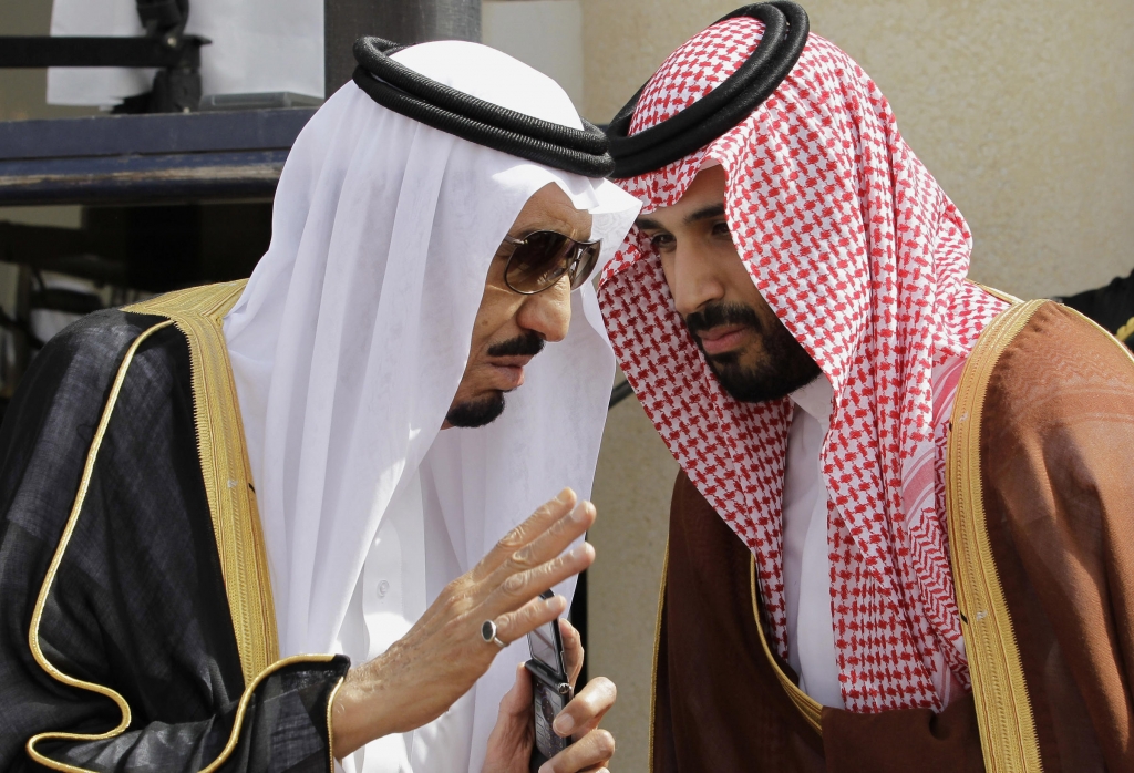 Saudi Arabia's King Salman speaks with his son Mohammed in the capital Riyadh in 2012. The king was the crown prince at the time. When he assumed the throne last year Salman named Mohammed now 30 the deputy crown prince and defense minister