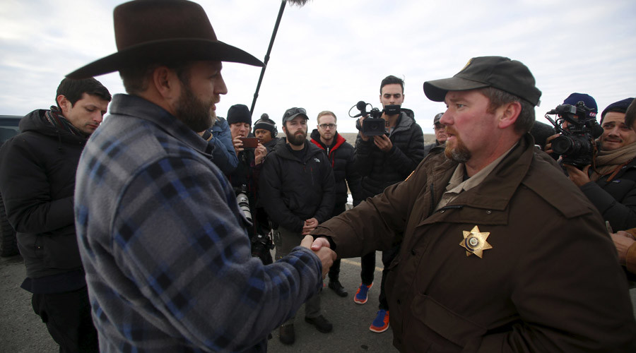 Ammon Bundy meets with Harney County Sheriff David Ward along a road south of the Malheur National Wildlife Refuge near Burns Oregon