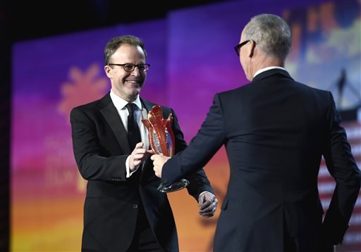 Michael Keaton right presents the Sonny Bono visionary award to Tom Mc Carthy at the 27th annual Palm Springs International Film Festival Awards Gala on Saturday Jan. 2 2016 in Palm Springs Calif