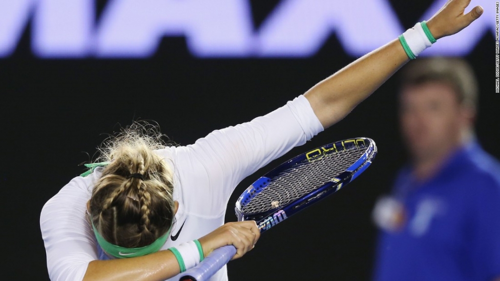 Belarus&#39 14th seed Victoria Azarenka salutes the Melbourne crowd after beating Alison Van Uytvanck of Belgium 6-0 6-0