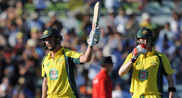 George Bailey watched by fellow centurion Steven Smith celebrates his third ODI hundred at the WACA