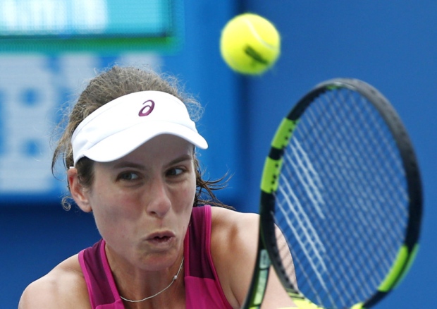 Johanna Kontamakes a backhand return to Zheng Saisai in Melbourne