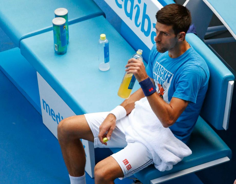 Serbia's Novak Djokovic takes a drink during a practice session ahead of the men's singles final at the Australian Open tennis championships in Melbourne Australia Saturday Jan. 30 2016. Djokovic will play Britain's Andy Murray on Sunday Jan. 31. Phot