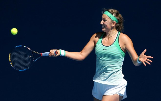 Victoria Azarenka of Belarus hits a forehand return to Barbora Strycova of the Czech Republic during their fourth round match at the Australian Open tennis championships