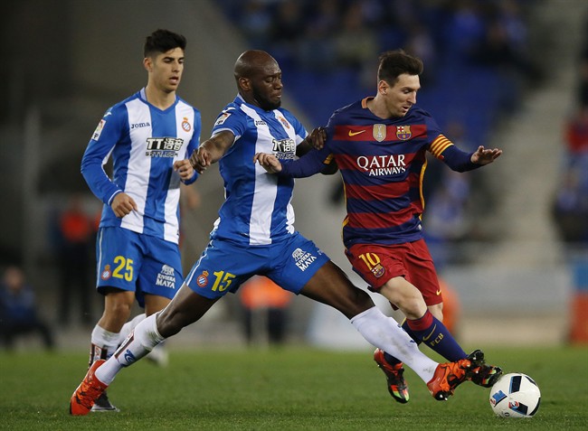 FC Barcelona's Lionel Messi right duels for the ball against Espanyol's Michael Ciani center during a Copa del Rey soccer match at RCDE stadium in Barcelona Spain Wednesday Jan. 13 2016