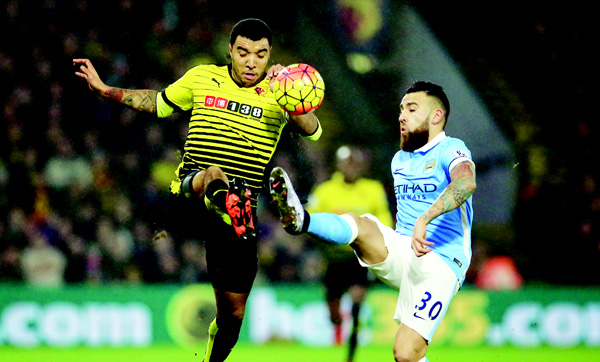 Watford’s Troy Deeney, and Manchester City’s Nicolas Otamendi in action during their British Premier League soccer match at Vicarage Road London on Jan 2