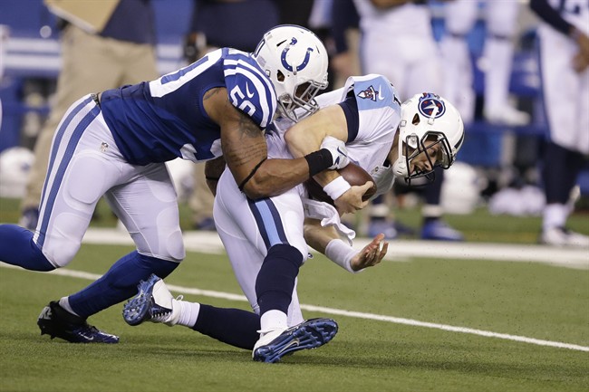 Indianapolis Colts inside linebacker Jerrell Freeman sacks Tennessee Titans quarterback Alex Tanney during the second half of an NFL football game in Indianapolis Sunday Jan. 3 2016. The Colts defeat the Titans 30-24. (AP