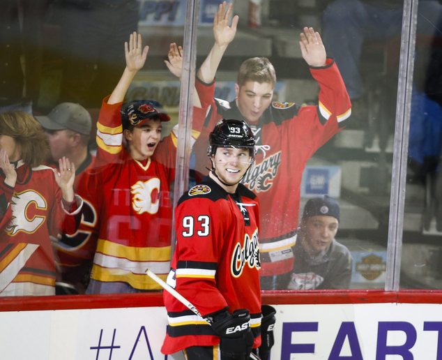 Calgary Flames Sam Bennett celebrate his fourth goal during the third period of an NHL hockey game Wednesday Jan. 13 2016 in Calgary Alberta. (Jeff McIn