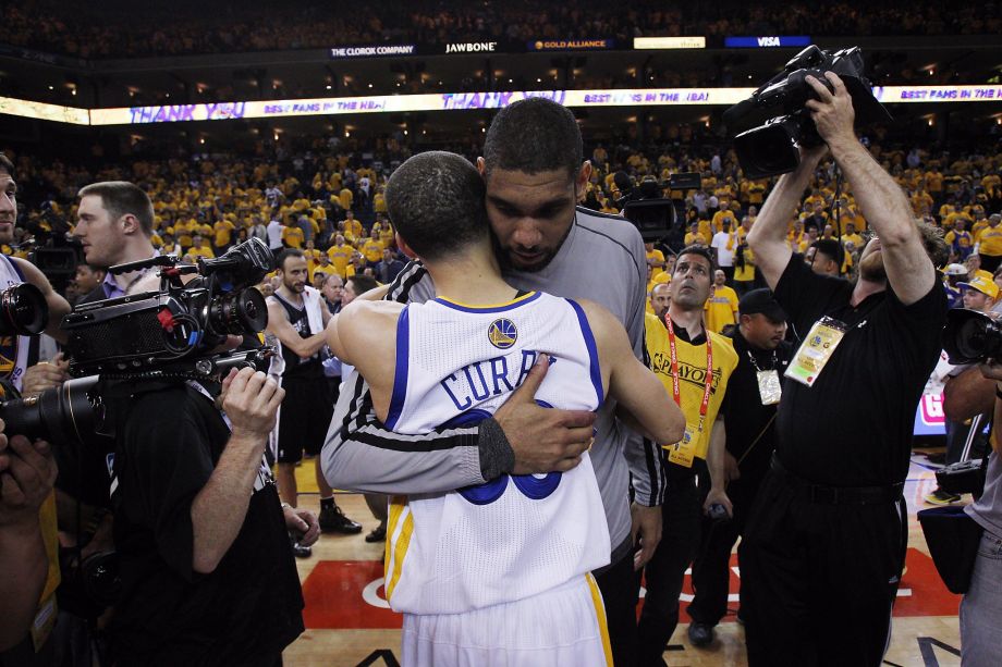 Stephen Curry hugs Tim Duncan after the Warriors lost to the Spurs 94-82. The Golden State Warriors played the San Antonio Spurs in Game 6 of the Western Conference Semifinals at Oracle Arena in Oakland Calif. on Thursday