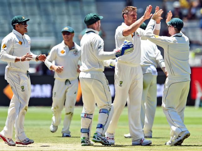 Australian paceman James Pattinson celebrates dismissing West Indies batsman Rajendra Chandrika with teammate Steve Smith on the fourth day of the second cricket Test in Melbourne