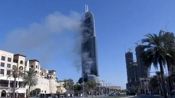 Luxury high-rise hotel bursts into flames near New Year's Eve fireworks display