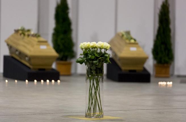 Coffins with the remains of of ten German tourists killed in a suicide bomb attack at Istanbul's historic Sultanahmet district are laid out in a hangar at Berlin's Tegel Airport after they were repatriated