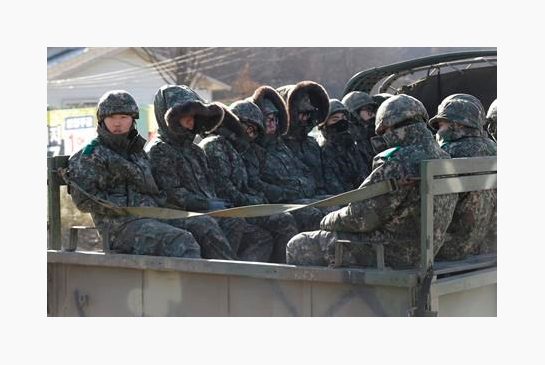 South Korean army soldiers ride on a truck in Yeoncheon south of the demilitarized zone that divides the two Koreas South Korea Friday Jan. 8 2016. South Korea retaliated for North Korea’s nuclear test with broadcasts of anti Pyongyang propaganda