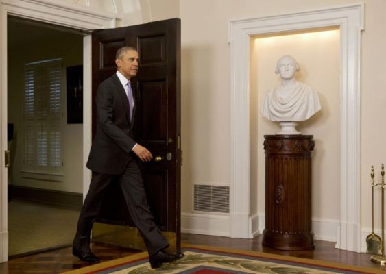 President Barack Obama enters the Cabinet Room