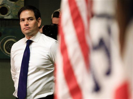 Republican presidential candidate Sen. Marco Rubio R-Fla. waits at the side of the stage while being introduced before speaking at a campaign stop in Council Bluffs Iowa Saturday Jan. 16 2016