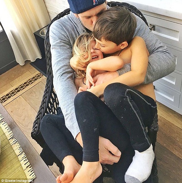 Consolation prize Gisele Bundchen shared an image of husband Tom Brady cuddling their children on Monday after his crushing AFC Championship Game loss