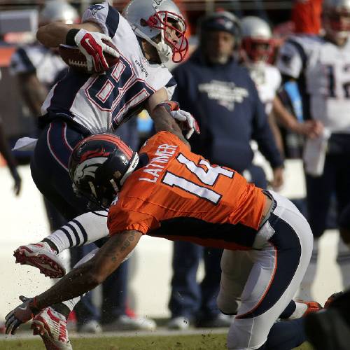 Patriots&#039 Danny Amendola is stopped by Denver Broncos&#039 Cody Latimer during the second half of the NFL football AFC Championship game between the Denver Broncos and the New England Patriots Sunday Jan. 24 2016 in Denv