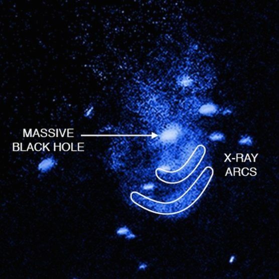 The Chandra X-ray Observatory caught two waves of hot X-ray emitting gas emanating from the supermassive black hole at the center of NGC 5195. Image via NASA  CXC  Univ of Texas  E Schlegel et