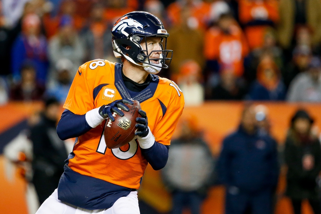 DENVER CO- JANUARY 3 Quarterback Peyton Manning #18 of the Denver Broncos looks to pass against the San Diego Chargers during a game at Sports Authority Field at Mile High