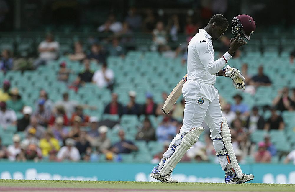 Carlos Brathwaite walks off after scoring 69 off 71 deliveries on day two of the third Test in Sydney