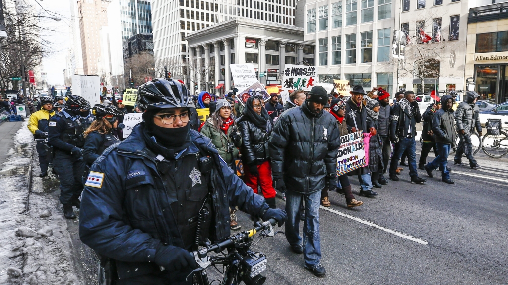 Chicago police escort protestors against police brutality and gun violence on Michigan Avenue in Chicago Illinois USA 31 December 2015