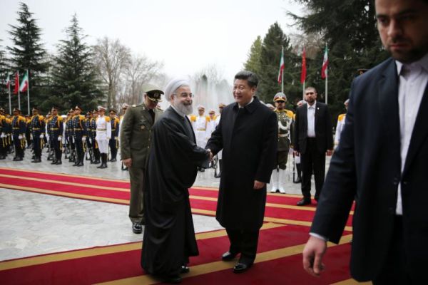 Chinese President Xi Jinping center right shakes hands